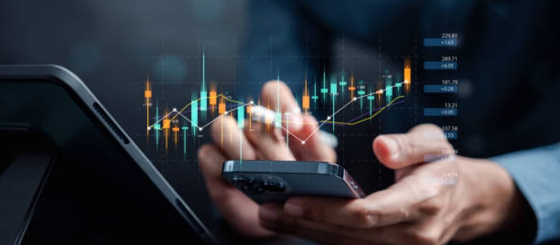 Businessmen investor think before buying stock market investment using smartphone to analyze trading data. investor analysis with stock exchange graph on screen. Financial stock market.