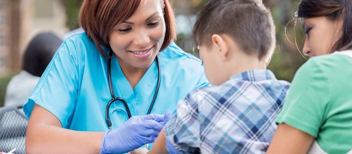public-health-worker-with-young-patient